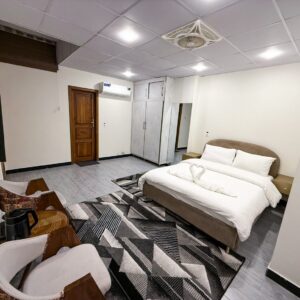 Modern hotel room in Islamabad with stylish sofa and elegant lighting